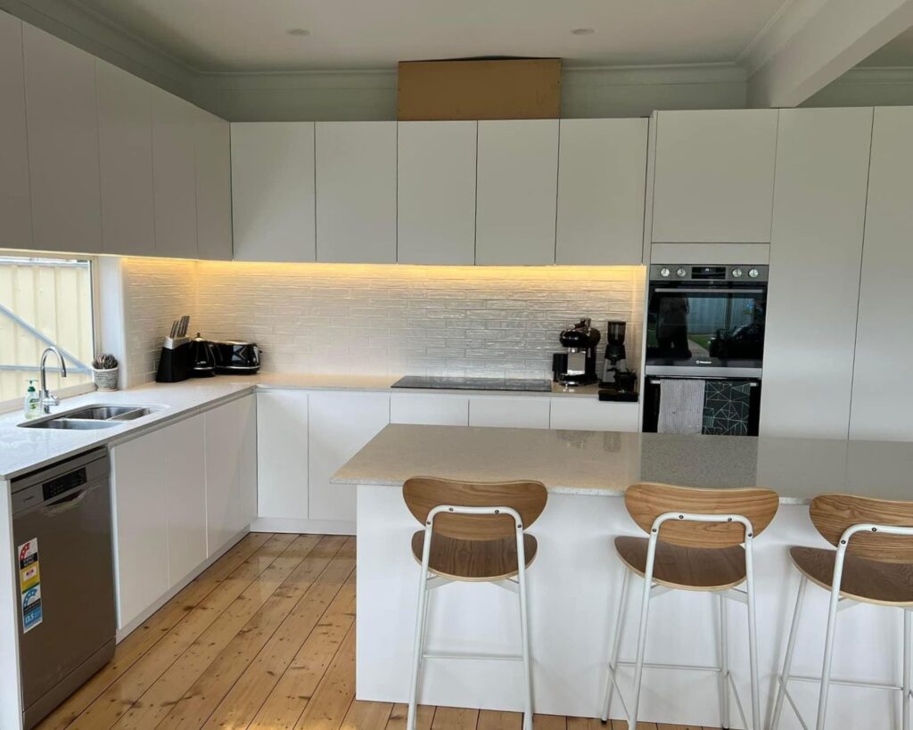 white kitchen with counter - renovation builders melbourne