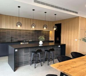 wood kitchen with black cabinets - renovation builders melbourne