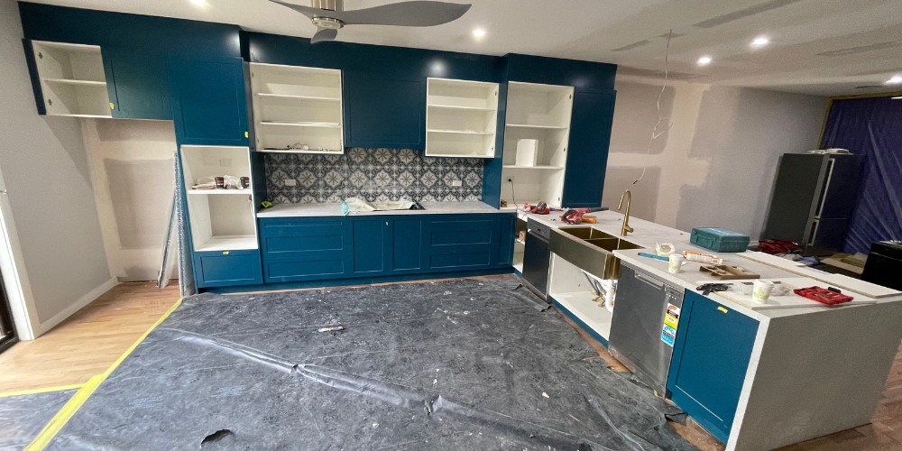 Kitchen under renovation, kitchen renovation, installing cabinetry in the kitchen - RBM