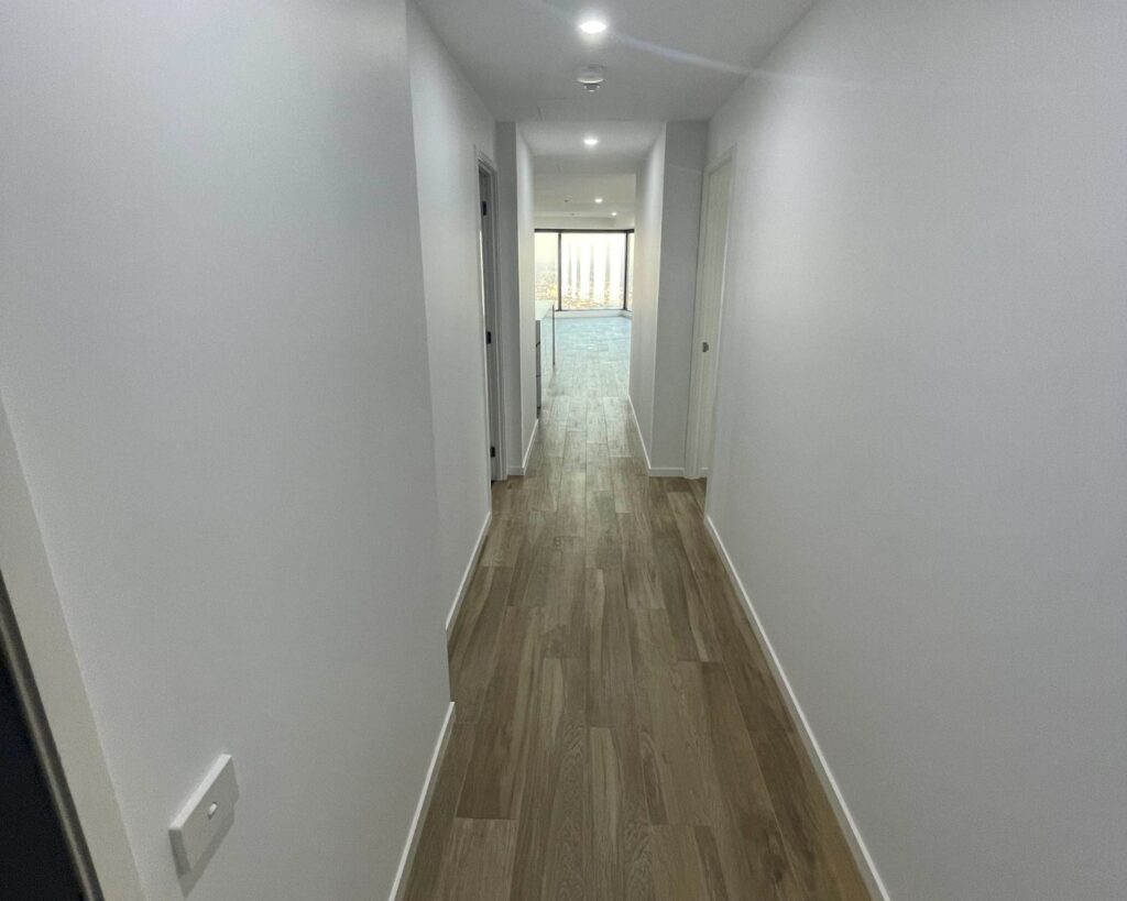 bright and spacious hallways, white walls, apartment renovation by Renovation Builders Melbourne, apartment remodeling